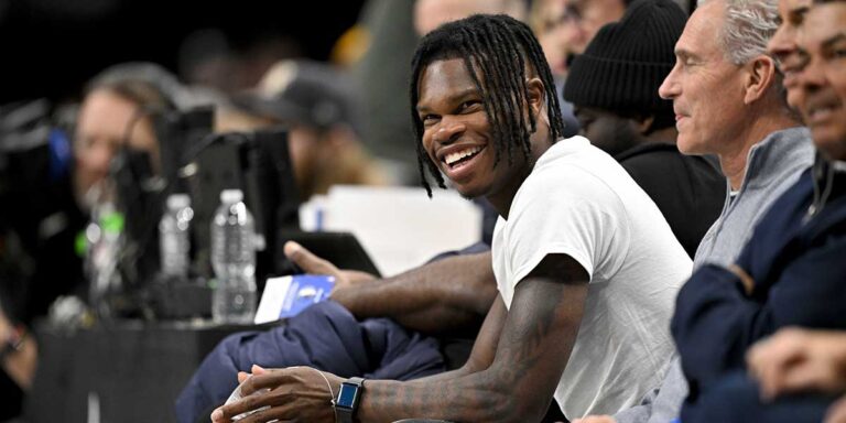 Colorado’s Travis Hunter gets an Anthony Edwards jersey at the Mavericks-Timberwolves game